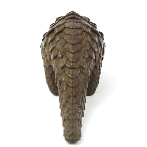 3799 - Japanese patinated bronze armadillo, impressed character marks to the base, 10.5cm in length