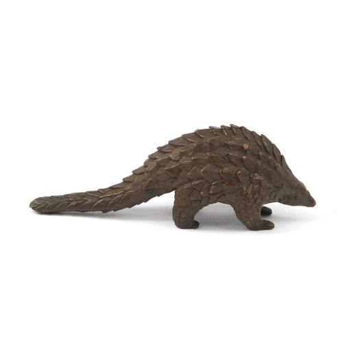 3799 - Japanese patinated bronze armadillo, impressed character marks to the base, 10.5cm in length