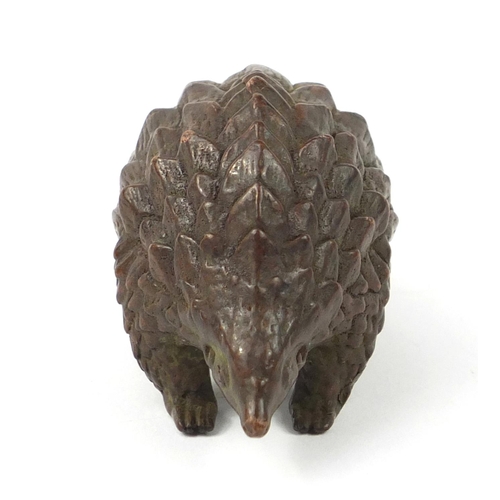 3799 - Japanese patinated bronze armadillo, impressed character marks to the base, 10.5cm in length