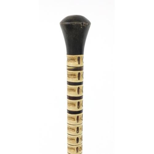 3617 - Whale vertebrae swagger stick with horn pommel and ferrule, 72cm in length