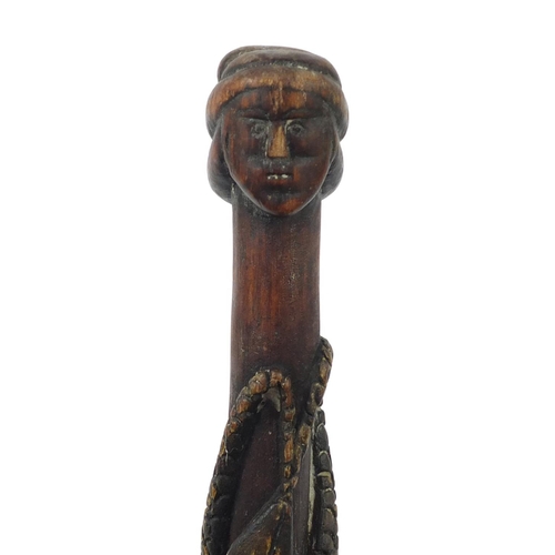 3844 - Tribal interest walking stick with figural pommel, carved with serpents, 92cm in length