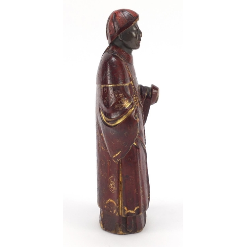 3562 - Antique Chinese red lacquered wood carving of a man wearing a robe, 24cm high