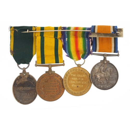 3192 - British military World War I four medal group comprising a pair and Territorial War medal awarded to... 