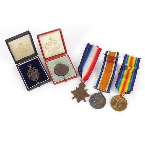 3405 - British military World War I trio with Royal Life Saving Society medallion and silver jewel, the tri... 