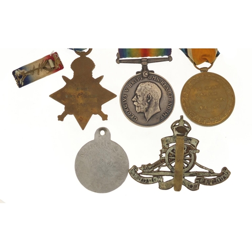 3772 - British military World War I trio with Mons star, Royal Artillery cap badge and dog tag, the trio aw... 