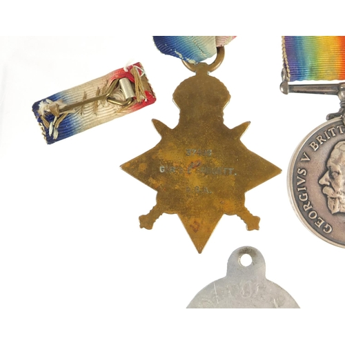 3772 - British military World War I trio with Mons star, Royal Artillery cap badge and dog tag, the trio aw... 