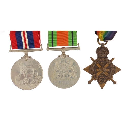 3774 - British military World War I and World War II three medal group with a box of issue including a Mons... 