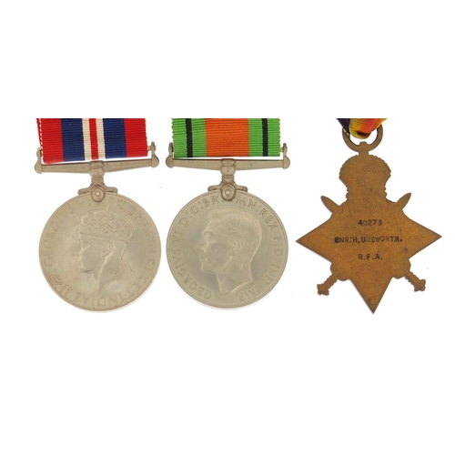 3774 - British military World War I and World War II three medal group with a box of issue including a Mons... 