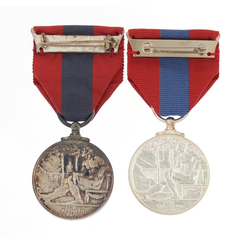 3286 - Two Elizabeth II Imperial Service medals with fitted cases awarded to Robert Young and Leslie Regina... 