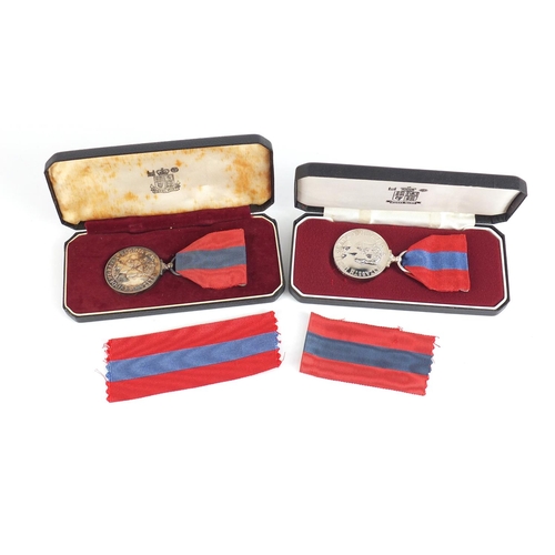 3286 - Two Elizabeth II Imperial Service medals with fitted cases awarded to Robert Young and Leslie Regina... 