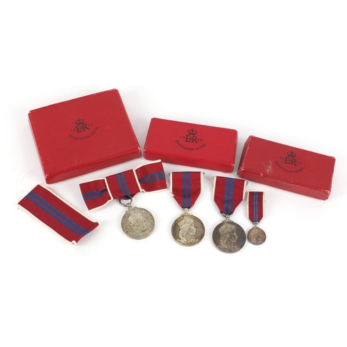 3317 - Three Elizabeth II 1953 coronation medals and a miniature with boxes including a ladies issue