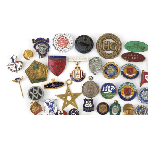 3708 - Vintage and later badges and lapels including South African Mining Brooch, BEA, The Society of Susse... 