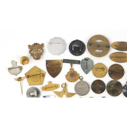 3708 - Vintage and later badges and lapels including South African Mining Brooch, BEA, The Society of Susse... 