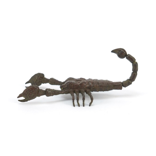 3574 - Japanese patinated bronze scorpian with articulated tail and pincers, 9cm in length