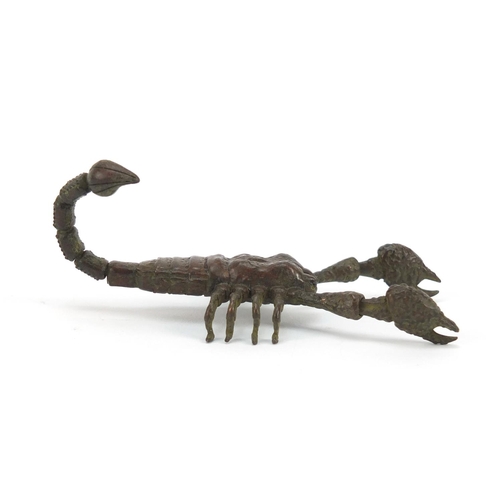 3574 - Japanese patinated bronze scorpian with articulated tail and pincers, 9cm in length