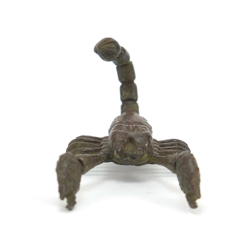 3574 - Japanese patinated bronze scorpian with articulated tail and pincers, 9cm in length