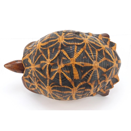 3831 - Anglo-Indian star tortoise tea caddy with ebony, fruitwood and exotic inlay, 24.5cm in length