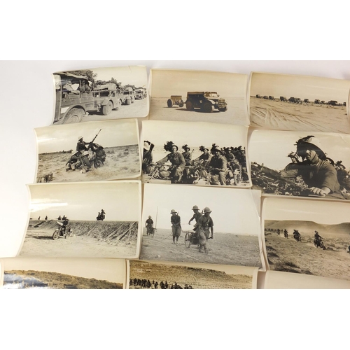 3198 - Twenty two German military black and white photographs, one signed Luce, including tanks and motorcy... 