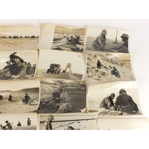 3198 - Twenty two German military black and white photographs, one signed Luce, including tanks and motorcy... 