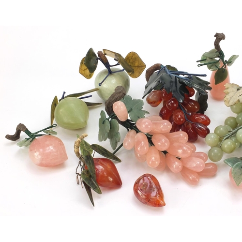 3385 - Collection of Chinese jade, agate and hardstone fruit including grapes, apple and peaches, the large... 