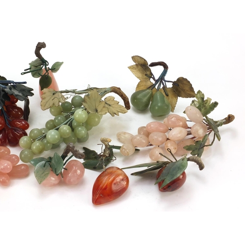 3385 - Collection of Chinese jade, agate and hardstone fruit including grapes, apple and peaches, the large... 