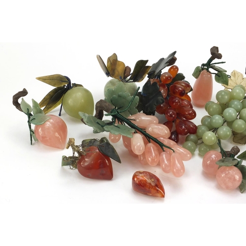 3385 - Collection of Chinese jade, agate and hardstone fruit including grapes, apple and peaches, the large... 