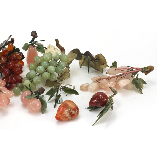 3385 - Collection of Chinese jade, agate and hardstone fruit including grapes, apple and peaches, the large... 