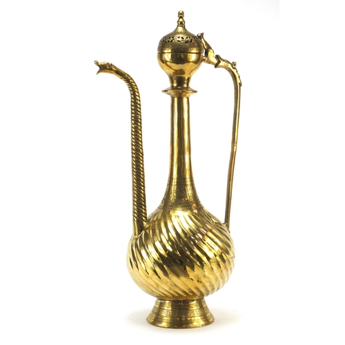 3839 - Islamic brass water pot with writhen body, 49.5cm high