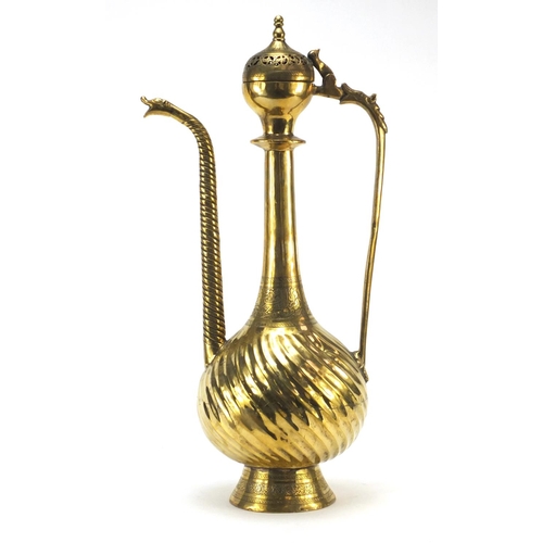 3839 - Islamic brass water pot with writhen body, 49.5cm high