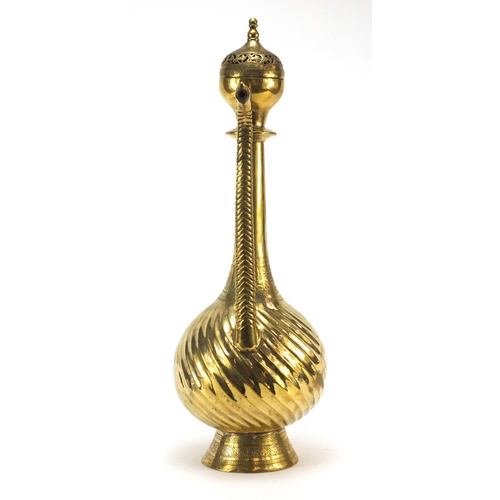 3839 - Islamic brass water pot with writhen body, 49.5cm high