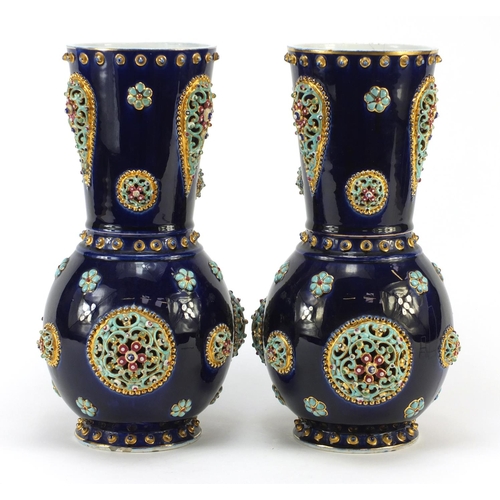 3914 - Large pair of continental porcelain vases with reticulated roundels, hand painted with flowers, poss... 