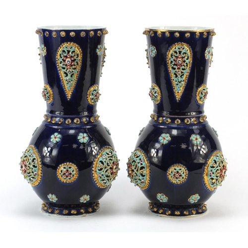 3914 - Large pair of continental porcelain vases with reticulated roundels, hand painted with flowers, poss... 