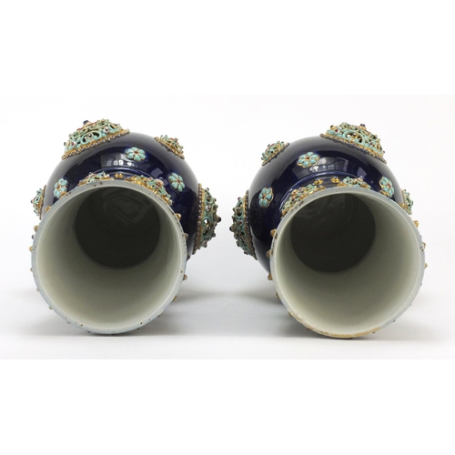 3914 - Large pair of continental porcelain vases with reticulated roundels, hand painted with flowers, poss... 