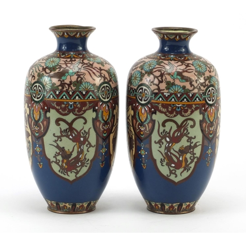 3387 - Pair of Japanese cloisonné vases enamelled with panels of birds of paradise and dragons, each 18.5cm... 