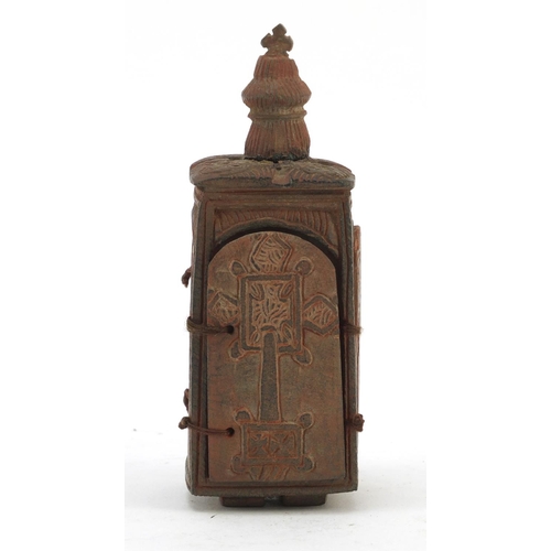 3828 - Russian Orthodox terracotta travelling shrine carved with figures and Orthodox crosses, 11.5cm high