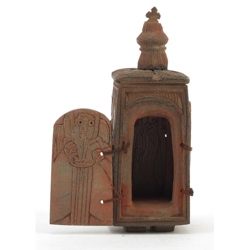 3828 - Russian Orthodox terracotta travelling shrine carved with figures and Orthodox crosses, 11.5cm high