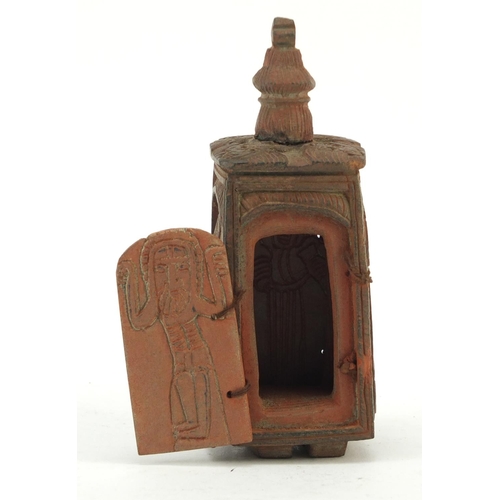 3828 - Russian Orthodox terracotta travelling shrine carved with figures and Orthodox crosses, 11.5cm high