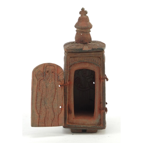 3828 - Russian Orthodox terracotta travelling shrine carved with figures and Orthodox crosses, 11.5cm high