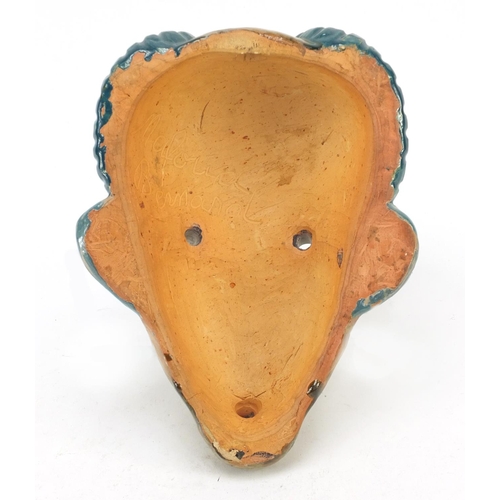 3646 - Continental Art Deco pottery face mask of a tribesman, indistinctly inscribed Mafoud Bemanol? to the... 