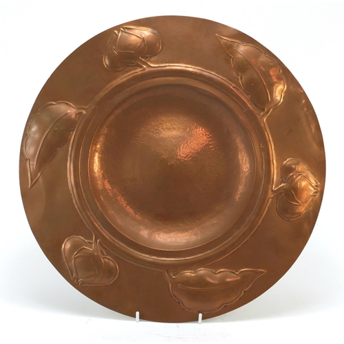 3260 - Arts & Crafts copper charger embossed with flower heads and leaves in the style of Newlyn, 40.5cm in... 