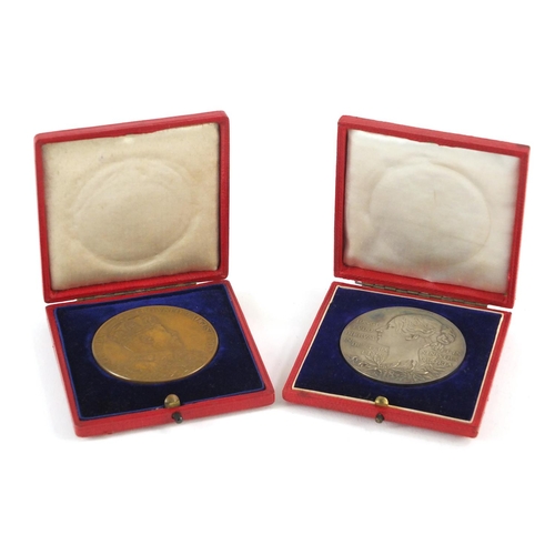 3316 - Two commemorative medallions with velvet lined tooled leather cases, comprising silver Victorian dia... 