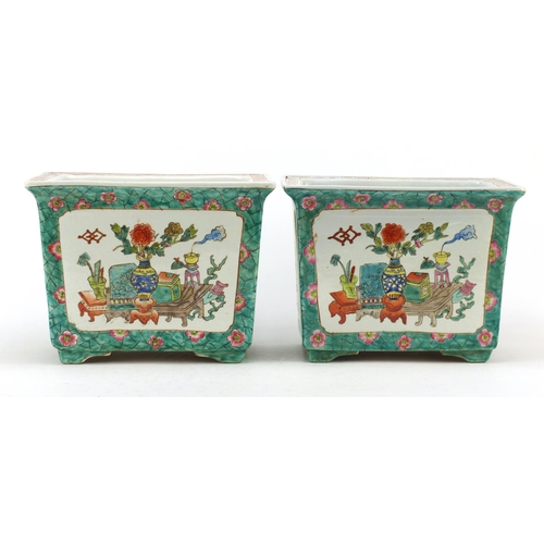 3555 - Pair of Chinese porcelain planters, each hand painted in the famille rose palette with panels of luc... 