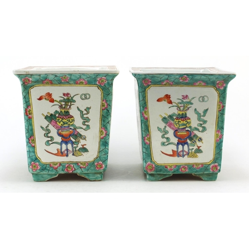 3555 - Pair of Chinese porcelain planters, each hand painted in the famille rose palette with panels of luc... 