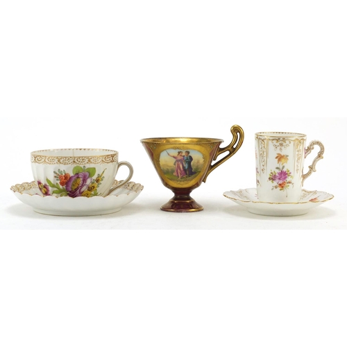 3912 - Two Dresden porcelain cabinet cups and saucers and a Vienna jewelled cup finely hand painted with a ... 