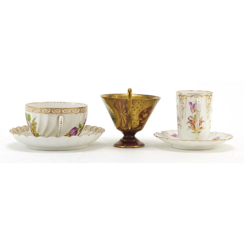 3912 - Two Dresden porcelain cabinet cups and saucers and a Vienna jewelled cup finely hand painted with a ... 