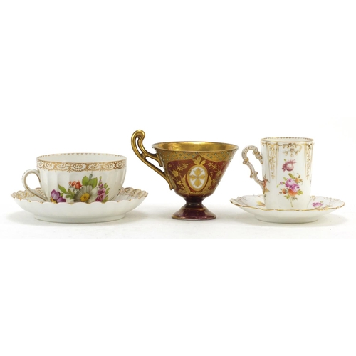 3912 - Two Dresden porcelain cabinet cups and saucers and a Vienna jewelled cup finely hand painted with a ... 