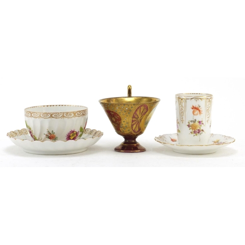 3912 - Two Dresden porcelain cabinet cups and saucers and a Vienna jewelled cup finely hand painted with a ... 