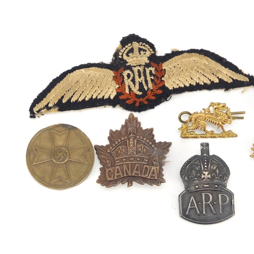 3416 - British and German militaria including RAF cloth patch, silver ARP lapel and the Buffs cap badge