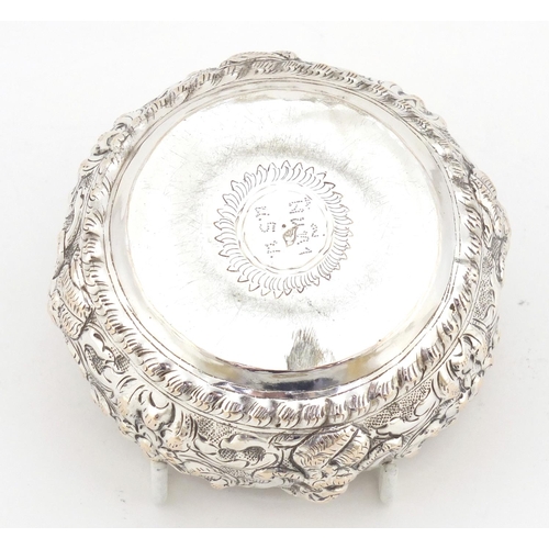 4137 - Circular unmarked Burmese silver bowl embossed with deities, 10cm in diameter, 82.8g