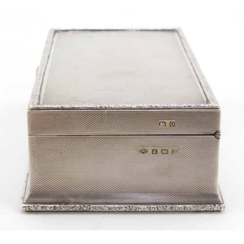 3229 - George V rectangular silver cigar box with hinged lid and engine turned decoration, by Adie Brothers... 